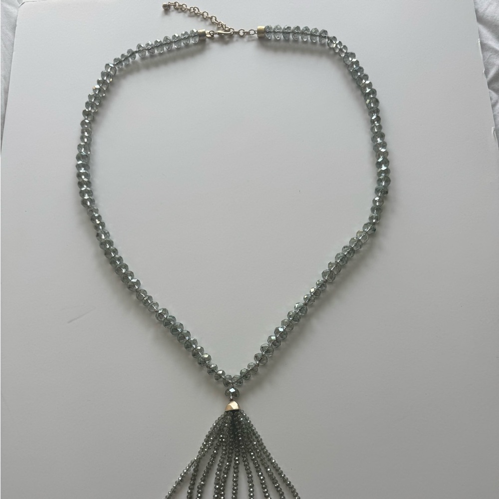 Beautiful costume jewelry piece and statement piece. Grey beads with gold clasp.
